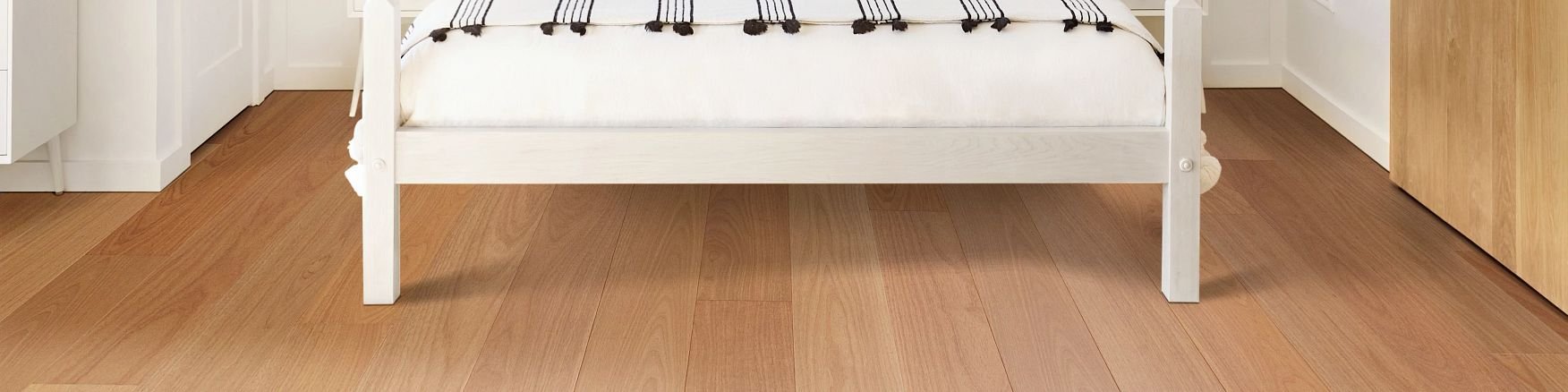White bed on hardwood floor from Specialized Floor Coverings in Dundas